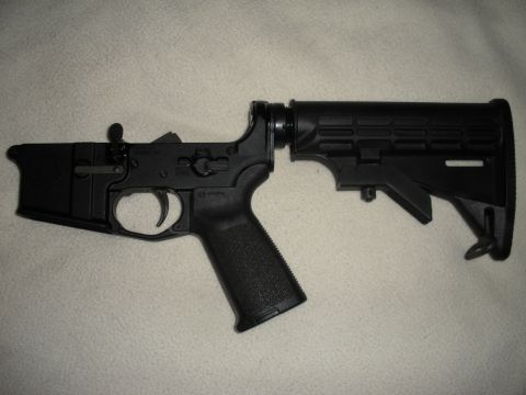 2005 Ford F-250 - AR-15 lower receiver assembly with a black pistol grip and adjustable stock attached.