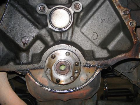 1978 Ford Bronco - Close-up of an engine block's rear seal area, showing the oil pan and flywheel housing.