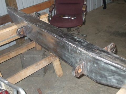 1995 Ford Bronco - Fabricated steel bumper assembly shown on sawhorses in a workshop setting.