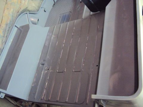 1948 Jeep Wrangler - Vehicle interior floor showing ribbed metal and a flat panel, likely undergoing restoration.