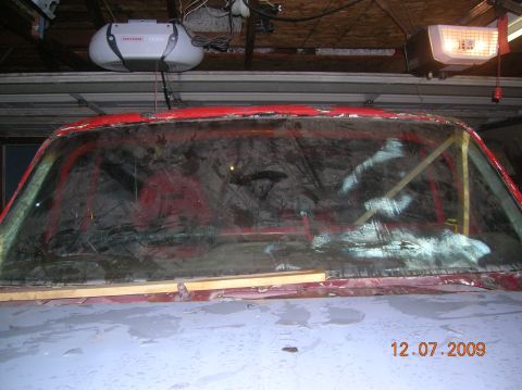 1985 Ford Bronco - Interior view of a 1985 Ford Bronco undergoing a rebuild, showing the windshield frame and roll cage.