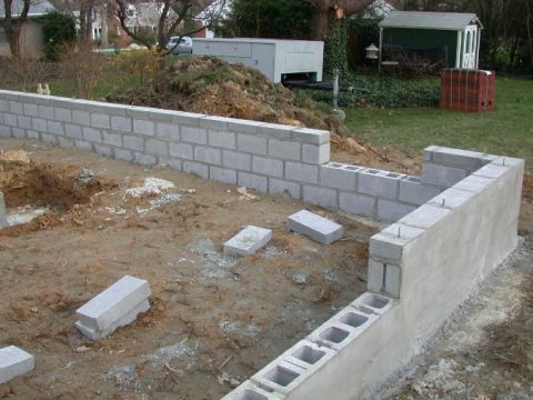 1996 Ford Bronco - Foundation construction in progress, showing cinder blocks and poured concrete elements.