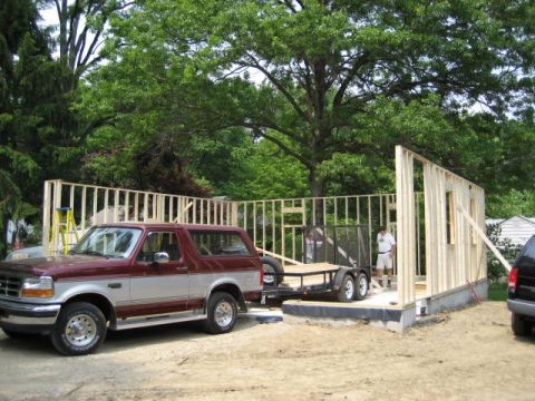 1996 Ford Bronco - A 1996 Ford Bronco is parked near a house under construction, hitched to a utility trailer.