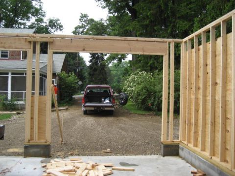 1996 Ford Bronco - Construction framing is in the foreground, with a red pickup truck visible in the background.