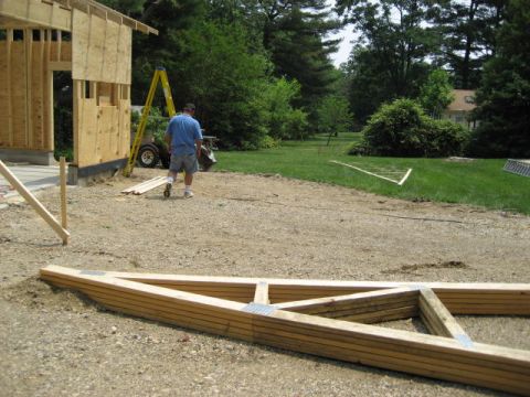 1996 Ford Bronco - Construction scene with lumber and a partially built structure.