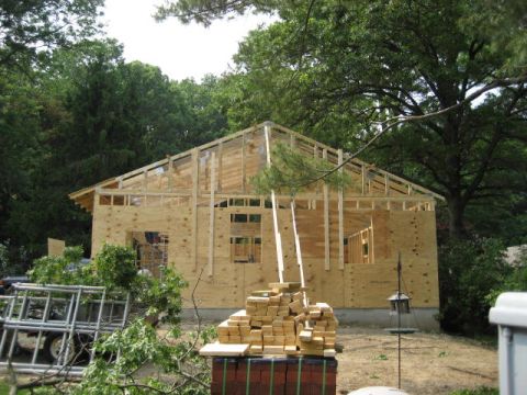 1996 Ford Bronco - A house is in the process of being built, with its wooden frame and plywood walls visible.