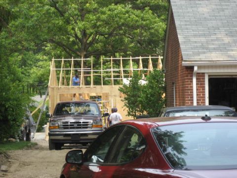 1996 Ford Bronco - A 1996 Ford Bronco is parked at a construction site with a house being built in the background.