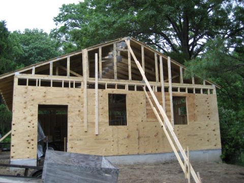 1996 Ford Bronco - Garage construction in progress, showing framing and plywood exterior walls.