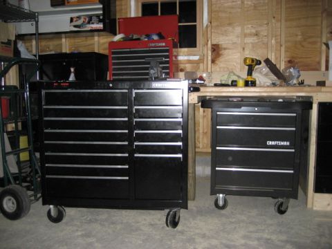 1996 Ford Bronco - Tool chests and workbench in a garage setting.