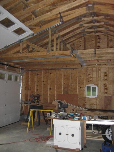 1996 Ford Bronco - Interior view of a garage space, showing construction elements, tools, and storage units.