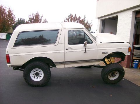 1989 Ford Bronco - This 1989 Ford Bronco has been modified with a significant lift kit and oversized off-road tires.