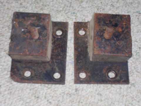 1979 Ford Pickup - Pair of rusty metal mounting brackets with rubber blocks and bolts.