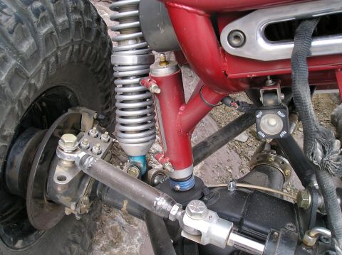 1986 Toyota Hilux - Custom suspension components are visible on this heavily modified off-road vehicle.