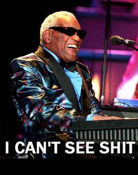 2000 Mercury Grand Marquis - Ray Charles performs live on stage, playing a keyboard with a microphone nearby.
