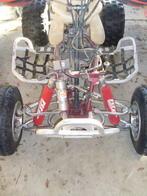 1987 Honda 250 R - The front suspension and engine of an ATV are shown in this close-up view.