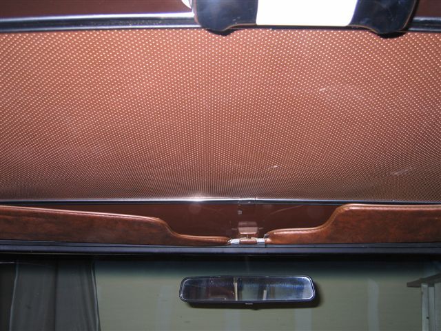 1978 Ford Bronco interior showing headliner and rearview mirror