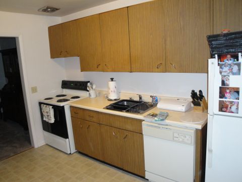 2000 Ford Crown Victoria - A view of a kitchen area with appliances and cabinetry.