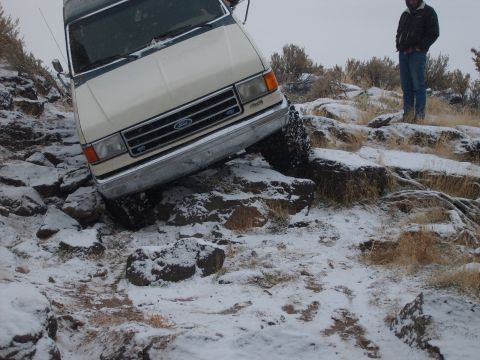 1989 Ford Bronco - Ford Bronco attempts to climb a steep, rocky, snow-covered hill.