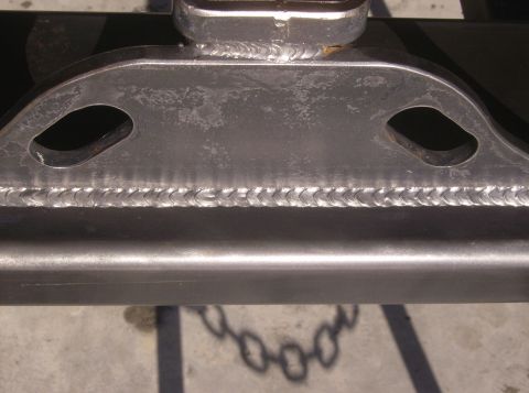 1989 Ford Bronco - Close-up view of a welded metal frame, possibly part of a trailer hitch or chassis component.