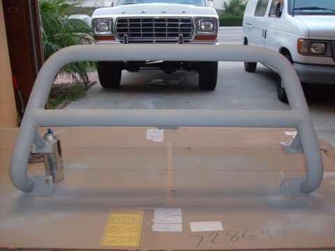 1978 Ford Bronco - Bull bar in front of a 1979 Ford F-Series truck and a white van.
