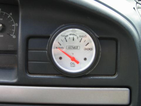 1992 Ford Bronco - An oil temperature gauge is visible on the dashboard of a vehicle.