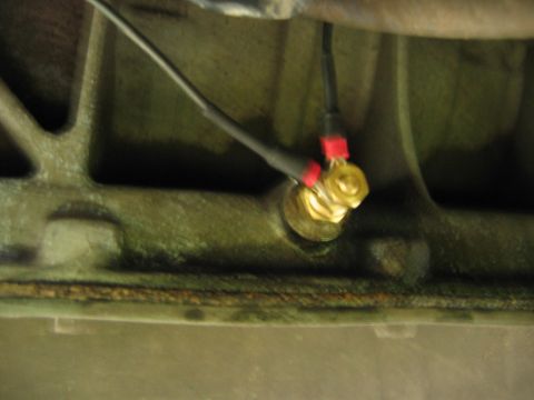 1992 Ford Bronco - Close-up of a transmission temperature sensor installation with connected wiring.