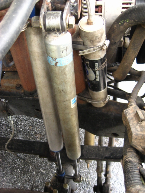 1989 Ford Bronco - The vehicle's suspension features two racing shocks, one with a visible "Racing Shox" label.