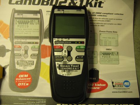 1992 Ford Bronco - Two Innova ScanTool CanOBD2 & 1 diagnostic devices are shown with printed information about OBD2 compliant vehicles and freeze frame data.