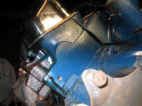 1968 Mercury Cougar - A close-up view of an engine block casting with visible part numbers and a chrome cover.