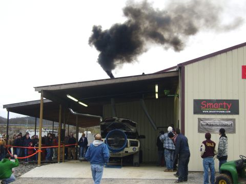 2007 Ford Mustang - A truck is being tested on a dynamometer, producing a significant amount of black smoke.