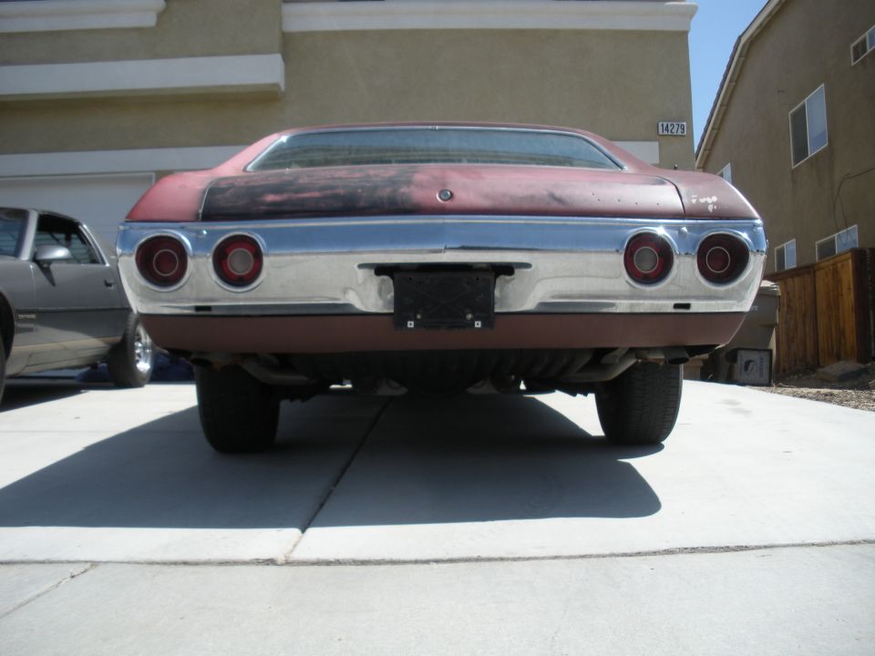 Maroon 1972 Chevrolet Chevelle rear view, showing dual taillights and chrome bumper