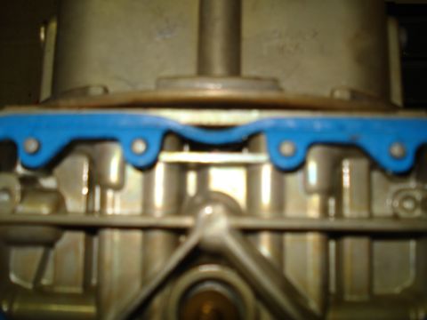 1984 Ford Bronco - Carburetor component with blue gasket visible.