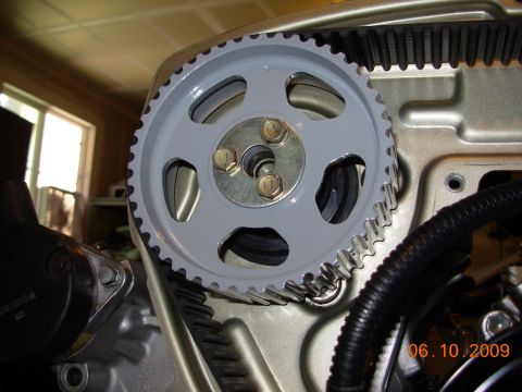 1991 Ford Taurus - A close-up view of a vehicle's engine timing belt and pulley system, with a date stamp of 06.10.2009.