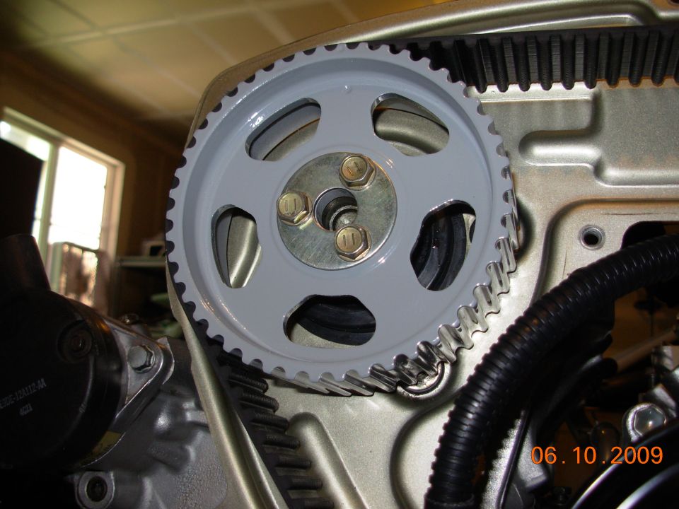 close-up of engine timing belt and pulley system