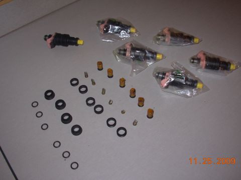 1991 Ford Taurus - A set of fuel injectors that were tested cleaned, along with new screen and seals.