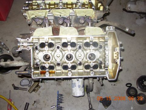 1991 Ford Taurus - Disassembled engine block, revealing the internal components of the cylinders and valves.