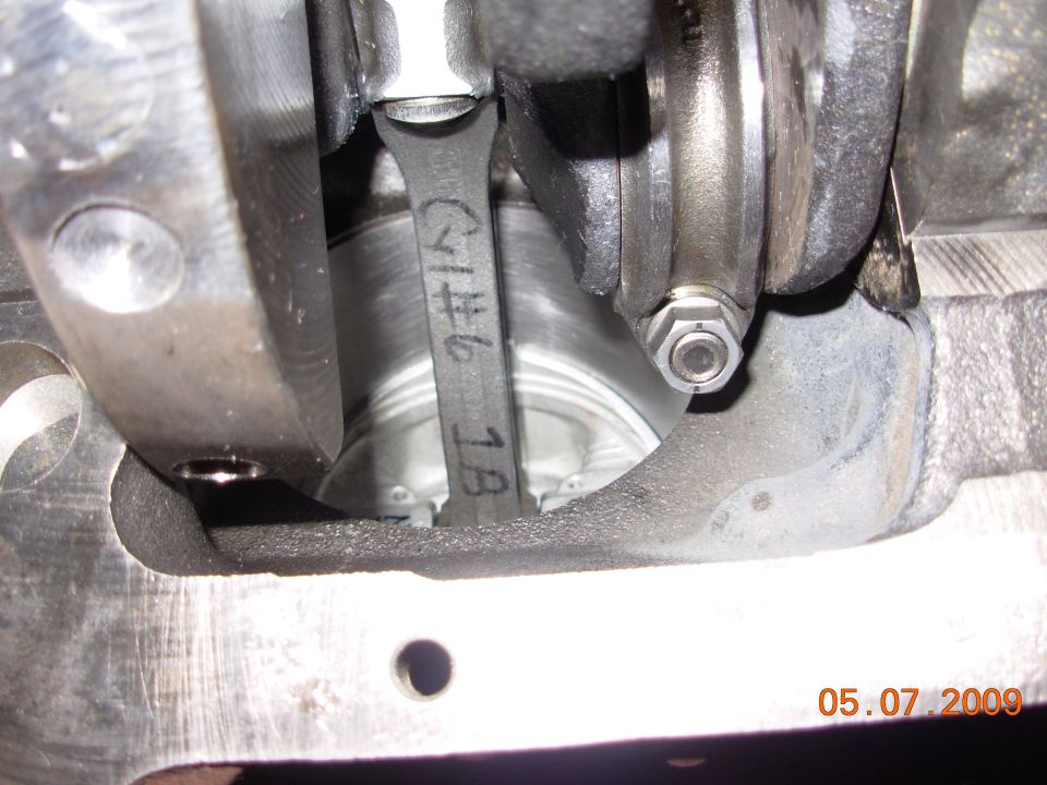 Engine crankshaft and connecting rod with handwritten markings 'C1#6 1B'