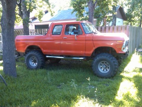 1978 Ford Bronco - This orange 1978 Ford Bronco features a lifted suspension and large off-road tires.