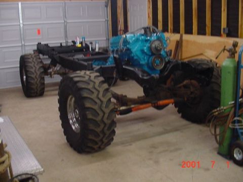1978 Ford Bronco - Chassis and engine assembly for a custom off-road vehicle, possibly undergoing restoration or modification.