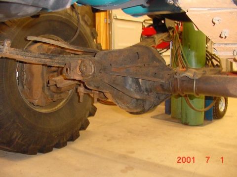 1978 Ford Bronco - Close-up view of the rear axle and tire assembly of an off-road vehicle.