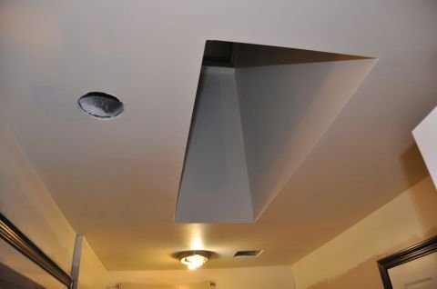 1996 Ford Bronco - A view of a ceiling with a large rectangular opening and a recessed light fixture.