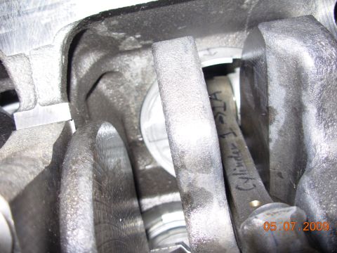 1991 Ford Taurus - Close-up view of engine internals, showing a connecting rod marked 'Cylinder 1-STA'.