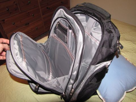 1984 Ford Bronco - Backpack interior shown with various pockets and zippers.