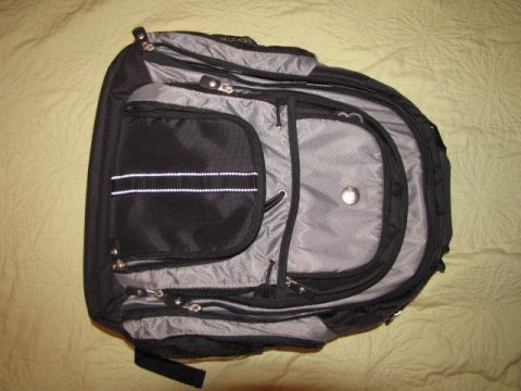 1984 Ford Bronco - A black and gray backpack is shown laid out on a textured surface.