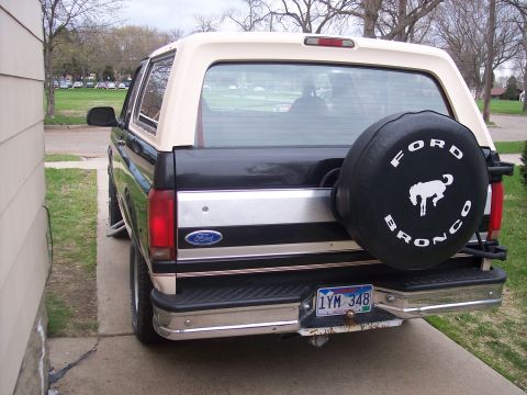 1992 Ford Bronco - This 1992 Ford Bronco is viewed from the rear, showing its two-tone paint and spare tire.