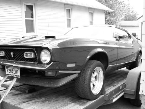 1972 Ford Mustang - 1972 Ford Mustang Mach 1 loaded onto a trailer, showing its front end and driver's side.