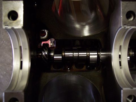 1972 Ford Mustang - Close-up view of an engine's crankshaft and bearing caps, likely during assembly or repair.