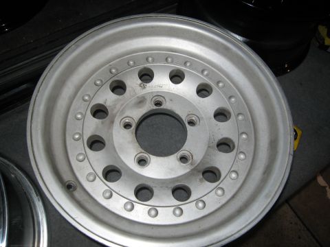 1986 Ford Bronco - Close-up of a single aluminum wheel, likely for a truck or SUV.