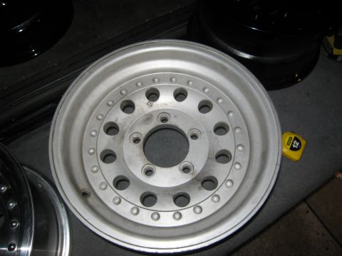 1986 Ford Bronco - Close-up of an aftermarket aluminum wheel, likely for a truck or SUV.