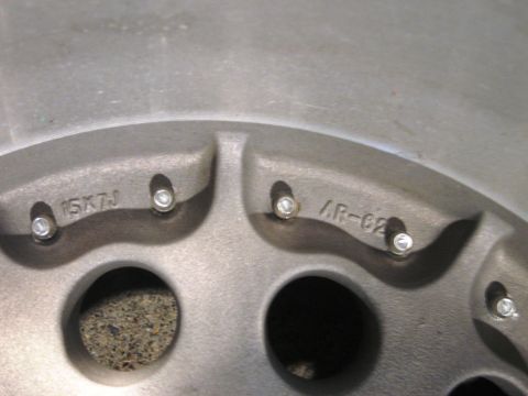 1986 Ford Bronco - Close-up view of a wheel showing size and part number markings.